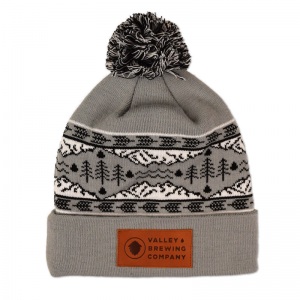 Valley Brewing knit pom beanie with faux leather patch.